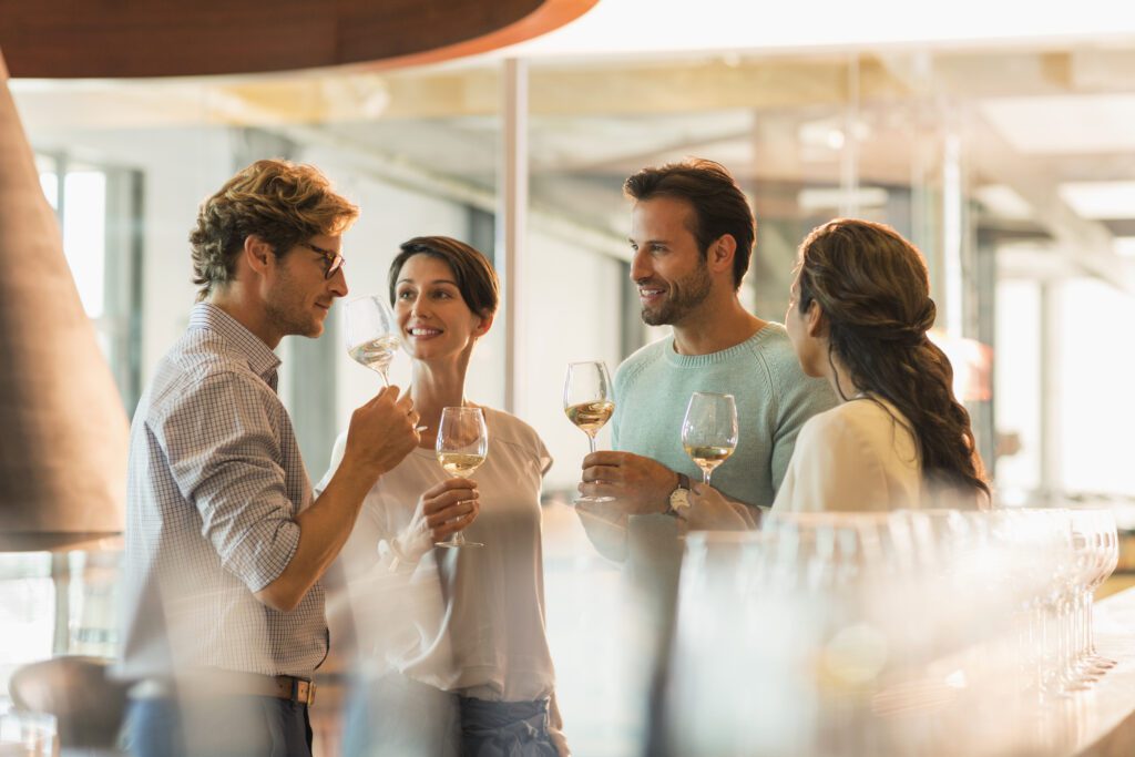 People enjoying wine at a gathering.