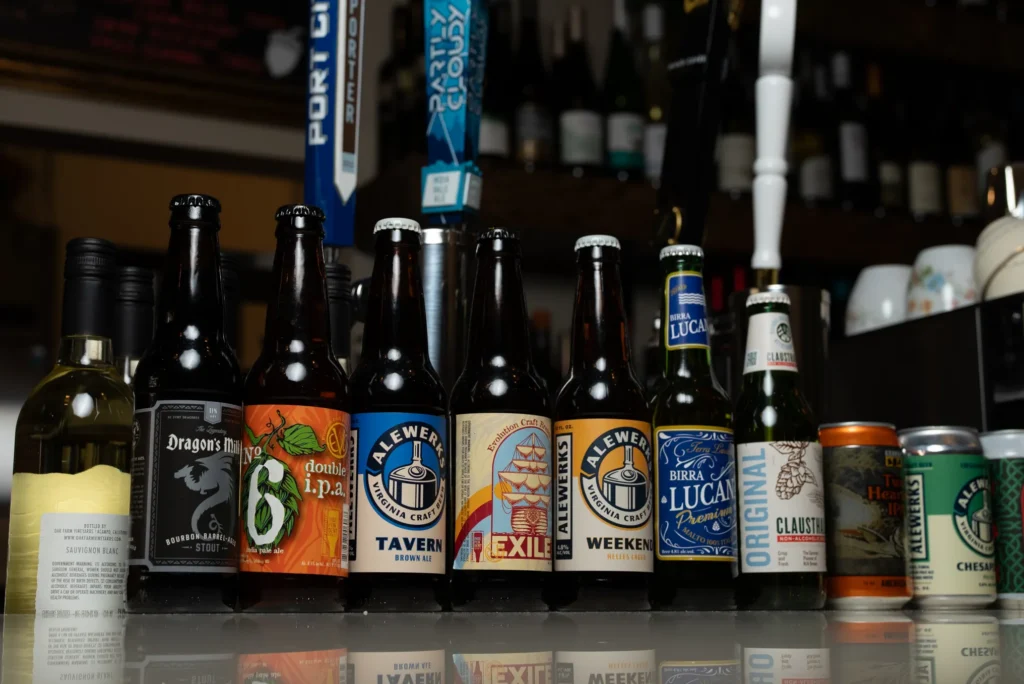 Selection of craft beer bottles and imports available at Vinicola Wine Bar.