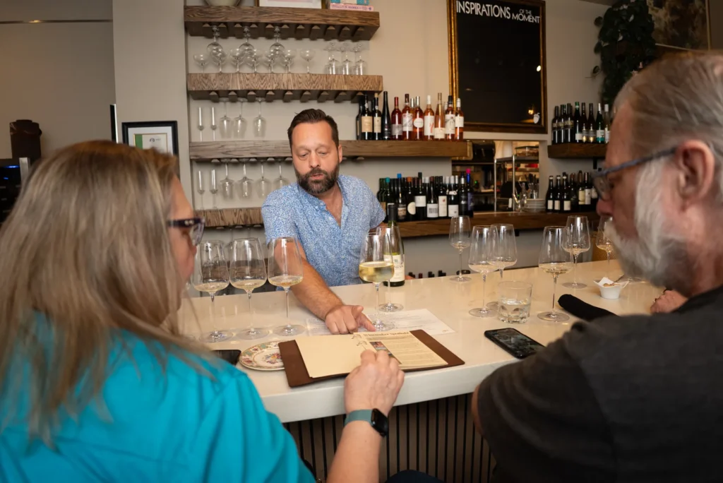 Guests enjoying an educational wine tasting during Wine Wisdom Wednesday at Vinicola.