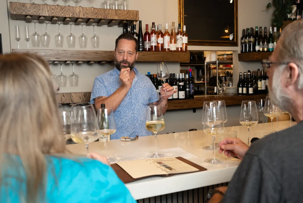 Guests enjoying a Wine Wisdom Wednesday tasting led by Vinicola's sommelier.